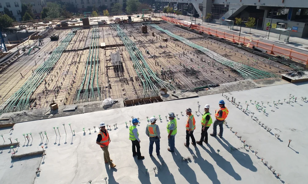 Construction workers in high visibility clothing on a building site