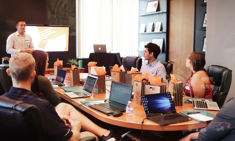 A consultancy team in a boardroom meeting, representing professional services firms