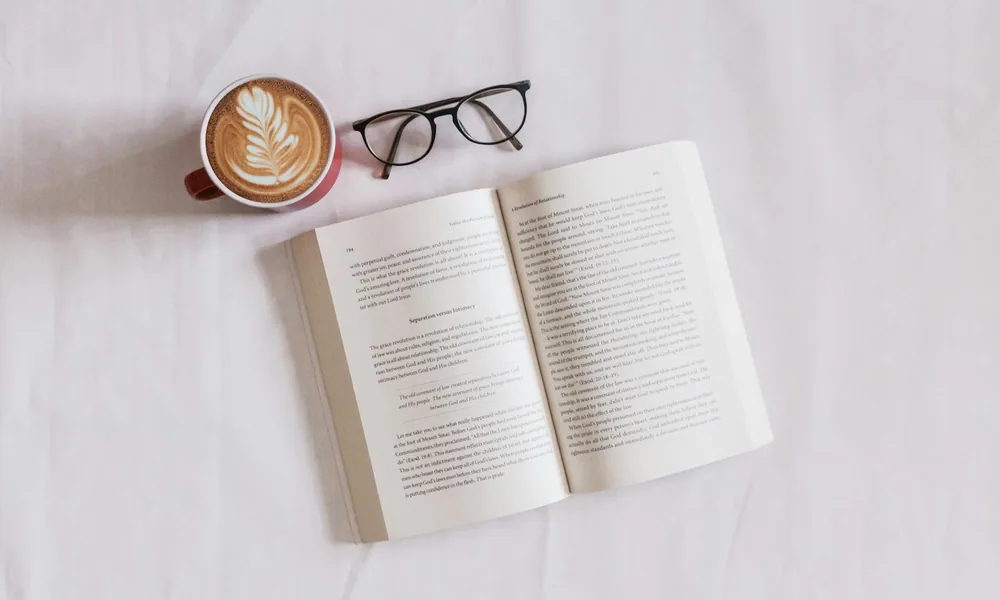 An open book and reading glasses, a plain-English glossary of invoice finance terms
