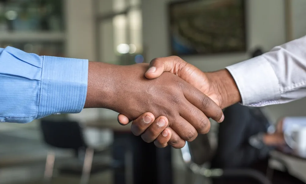 A business handshake agreeing a flexible revolving credit facility