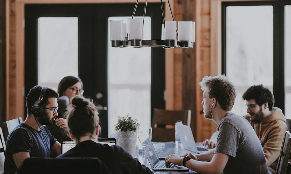 A busy recruitment agency team working in an open-plan office